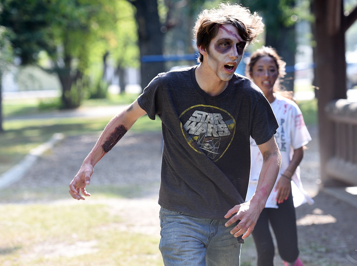 Isaac Glace chases campers during the Zombie Survival Camp.