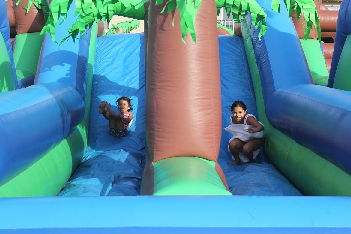 Richard Byrd/Columbia Basin Herald - Back-to-school supplies weren't the only things offered during Thursday night's back-to-school event held at The Assembly at Moses Lake, as the church had a variety of different activities, including a bouncy house, for attendees to enjoy.