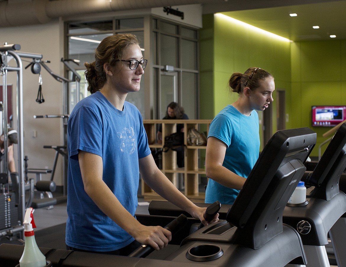 LOREN BENOIT/Press

North Idaho College sophomores Maddi Elliot, left, and Amaris Bartle walk on the treadmill at the new wellness fitness center on NIC&#146;s campus.