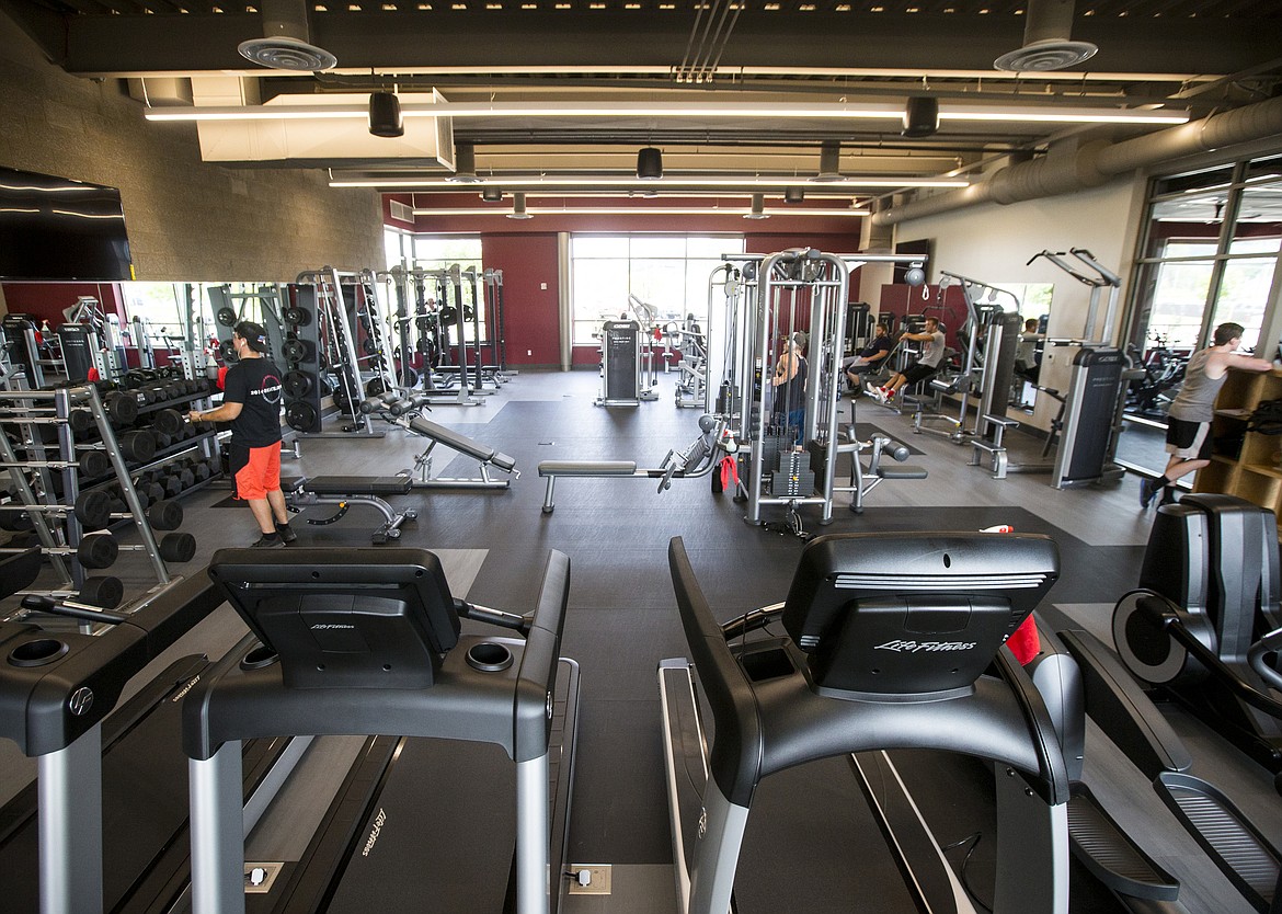 LOREN BENOIT/PressNorth Idaho College students workout Wednesday morning in the weight room at the new wellness fitness center on campus.