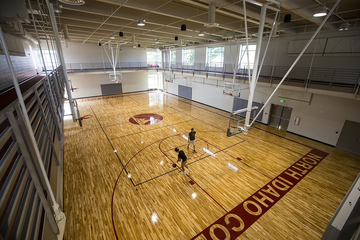 LOREN BENOIT/PressNorth Idaho College students Drake Lounsbury and Patrick Asbury shoot hoops Wednesday morning at the new Student Wellness and Recreation Center gym.