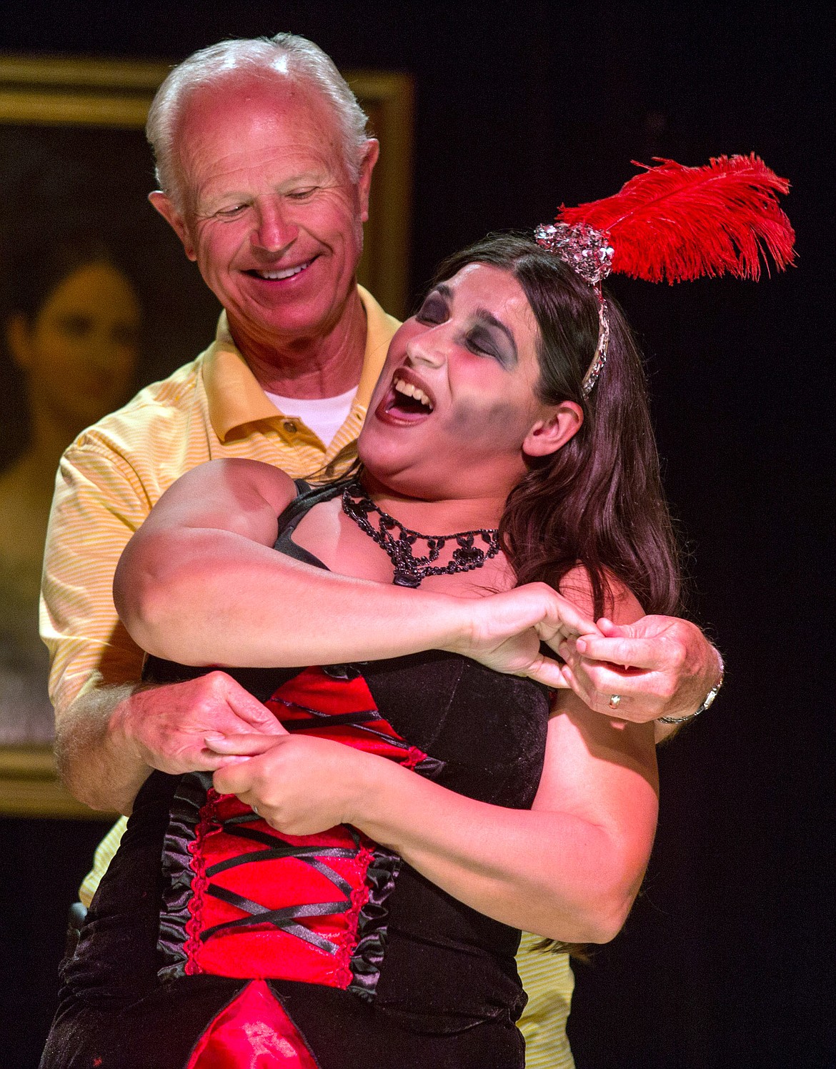 Stormy Miller of Montana City Old Town Players performs with an audience member Friday. See photo, more information on A8. (John Blodgett/The Western News)