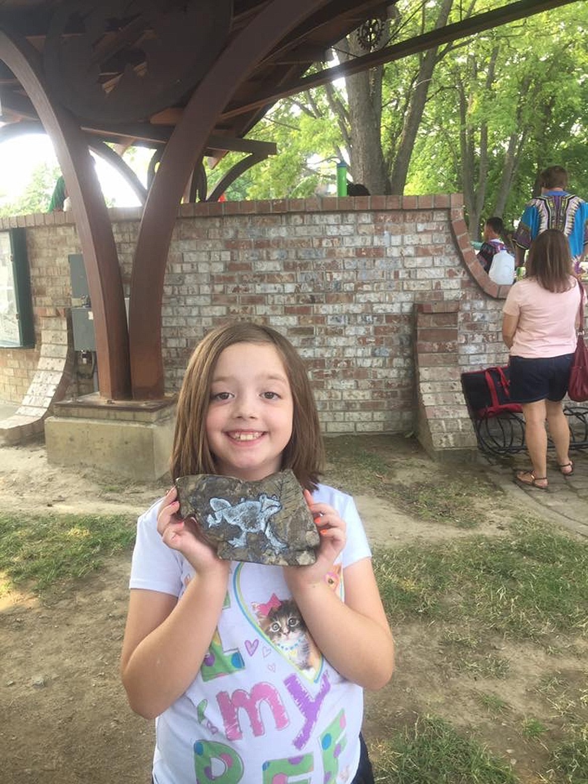 (Courtesy photo)
This young lady found a fossil painted by Lynn Walters of Sandpoint, who &#147;hid&#148; it at the Sandpoint Farmers Market at Farmin Park for the North Idaho Rocks group.