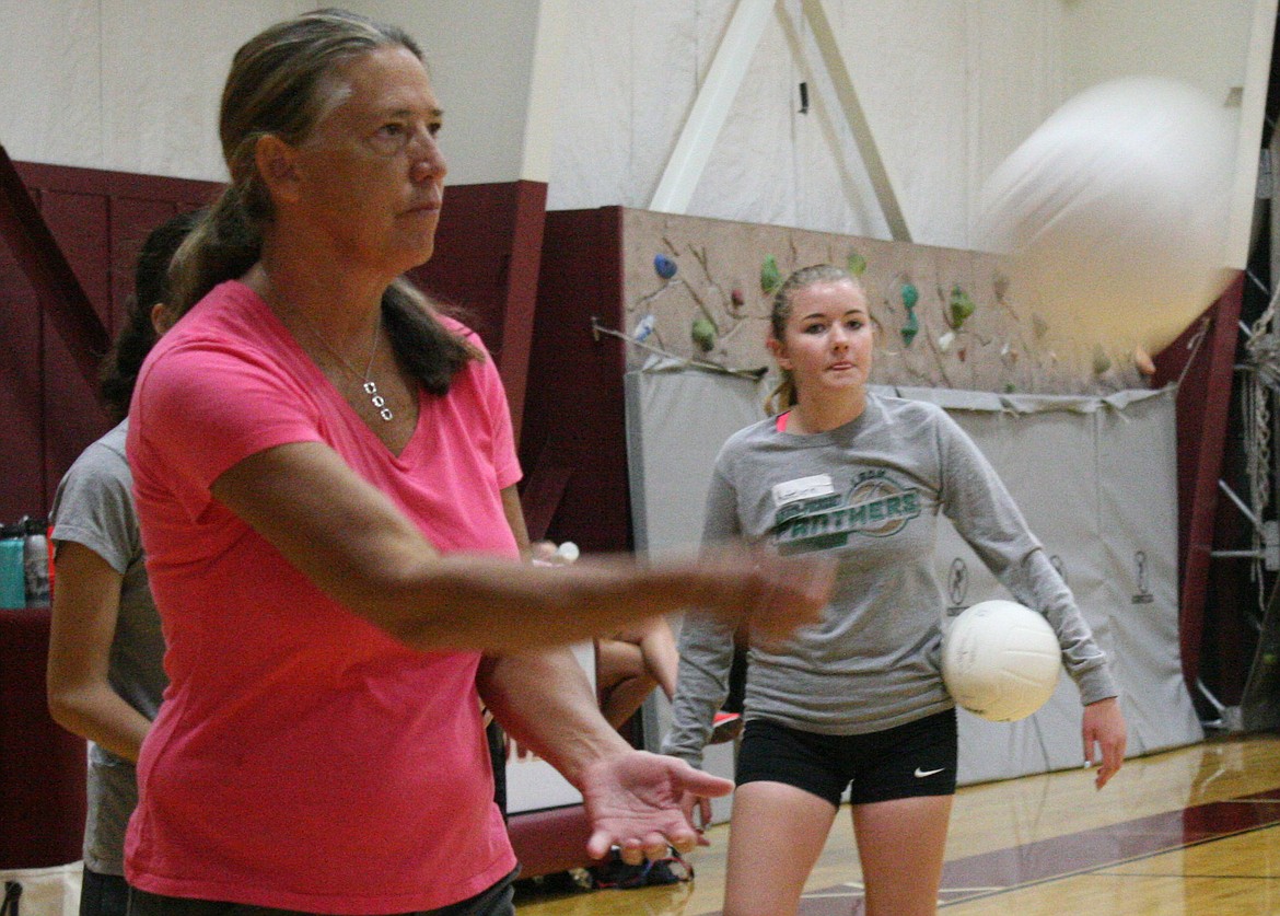 Troy High School volleyball coach Mandy Love serves during a drill on August 11. (Elka Wood/The Western News)