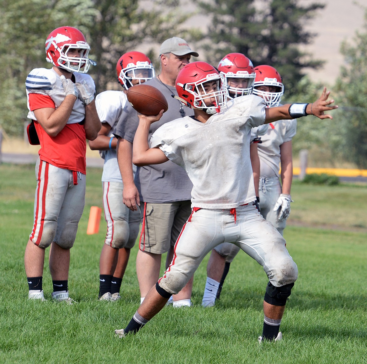 ARLEE QUARTERBACK prospect Lane Schall throws a pass in Saturday afternoon's practice at Arlee High School. (Jason Blasco/Lake County Leader)