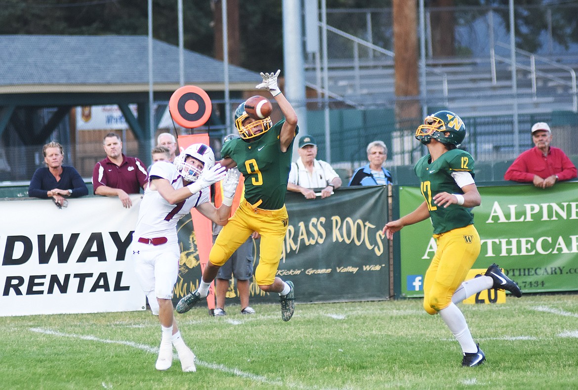 Josh Dudley breaks up a pass during a loss to Hamilton Friday. (Daniel McKay photos/Whitefish Pilot)