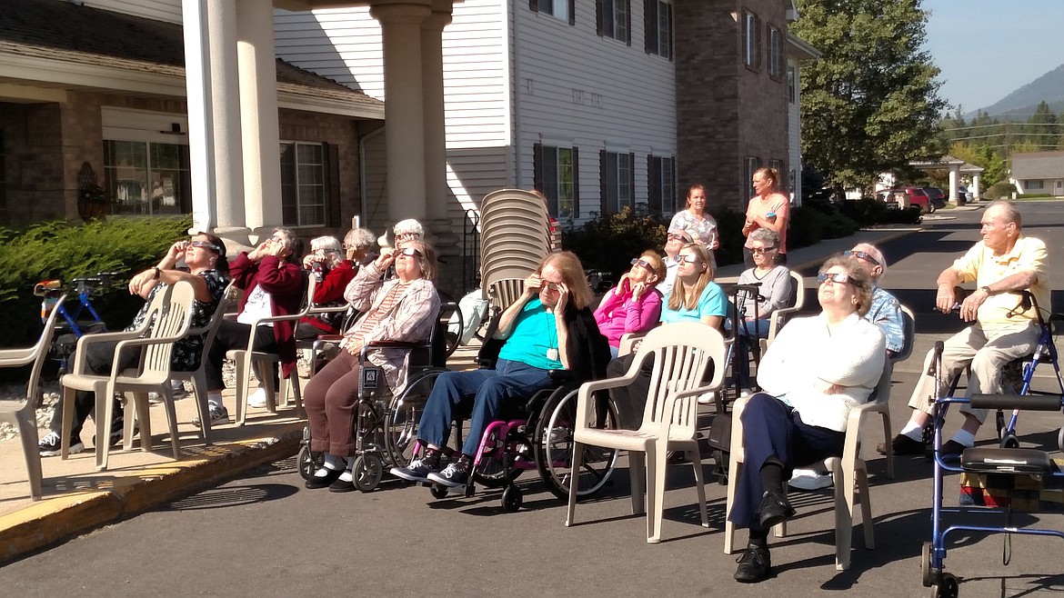 (Photo courtesy KEITH CONGLETON)
Residents and staff at The Bridge gather outside to outside to watch Monday&#146;s solar eclipse.