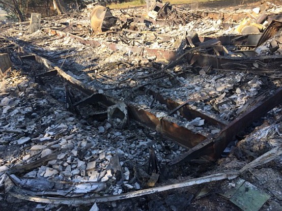 GoFundMe/courtesy photo - What is left of Alexander and Raisa Moskalets' home after it was destroyed by the Monument Hill Fire.