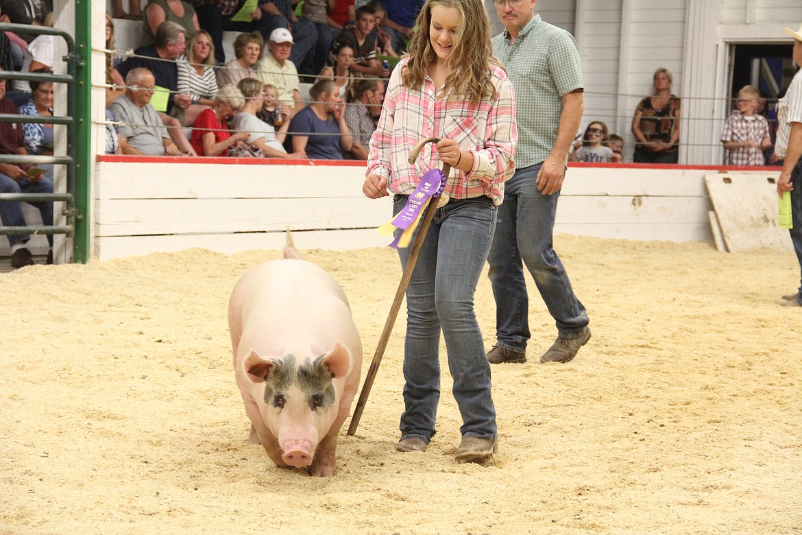 Photo by Tanna Yeoumans
Katelyn Smith shows off her award-winning swine.