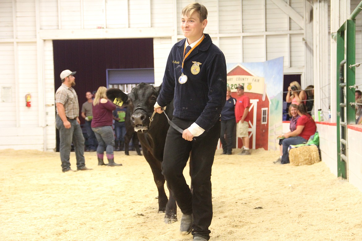 Photo By Tanna Yeoumans
Conner Underhill smiles to the audience while leading his project steer.