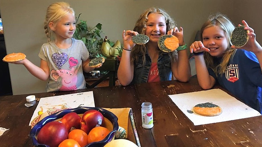 Lottie DiGiando, 4, Lane DiGiando, 9, and Perri Jasper, 9, made sun and moon sugar cookies to celebrate the eclipse. (Photo courtesy of Darlene Kuprienko Jasper).