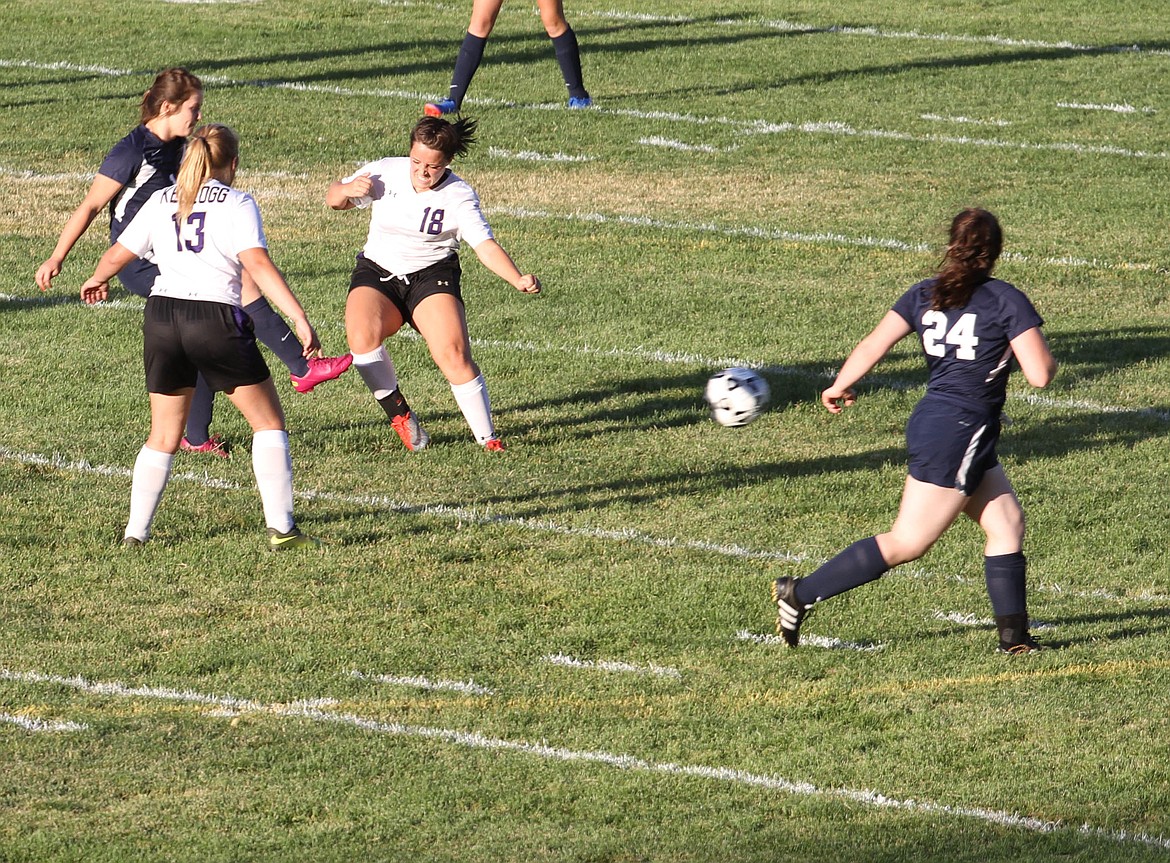 Wildcat Emma Noto literally throws herself into the Badger defender.