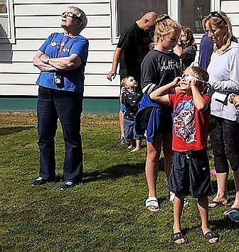 Family and friends gathered at the Mineral County Library in Superior to view the eclipse. (Photo by Florence Evans)