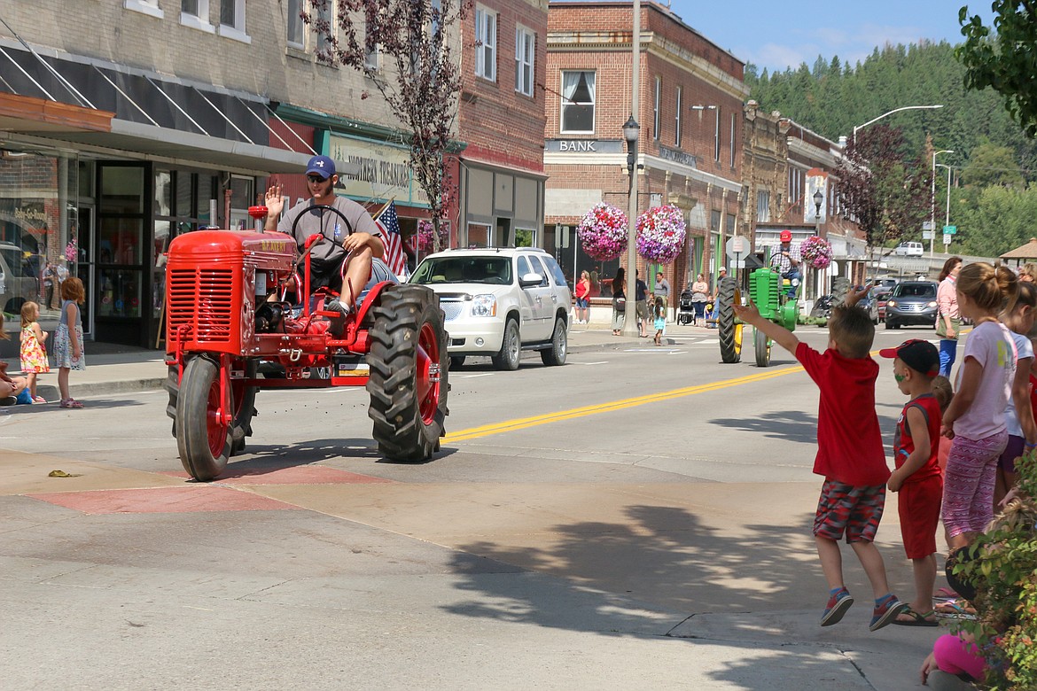 Steven Quirk learned to drive this tractor a half hour before the parade, following his mom, Cyndi Clark on the tractor in front of him, with his grandfather, Ken Irons, behind him in the John Deere.