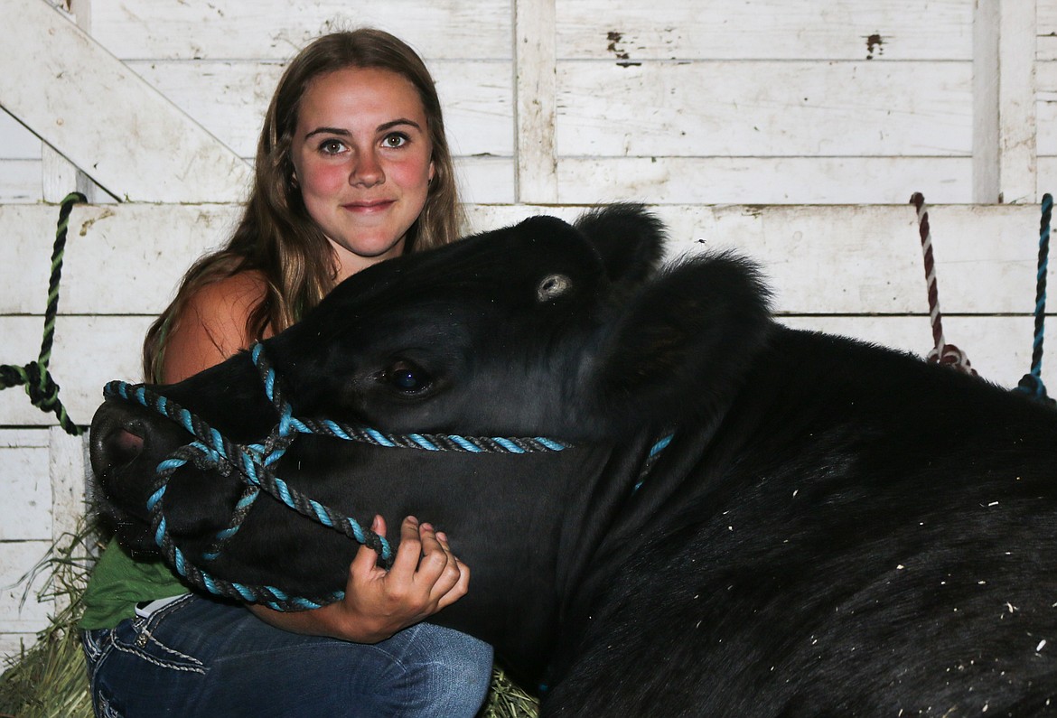 Photo by Mandi Bateman
Cheyenne Andrews and her steer, Ace. Andrews enjoys breeding cattle and already has a small herd of her own.