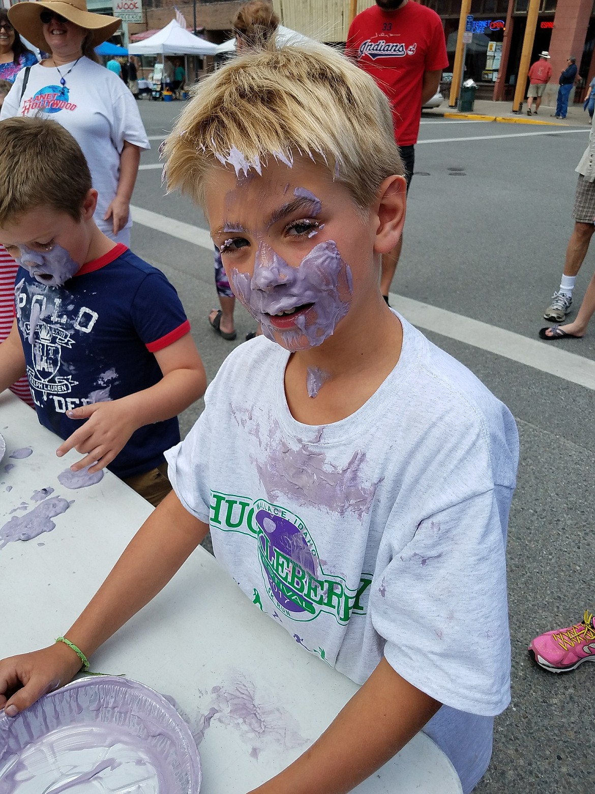 Pie eating contest winner Tyler Wydfel sports some purple war paint after digging in.