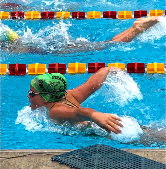 Genevieve Deschamps competes in the 50-meter butterfly. (Photo courtesy of Plains Swim Team)