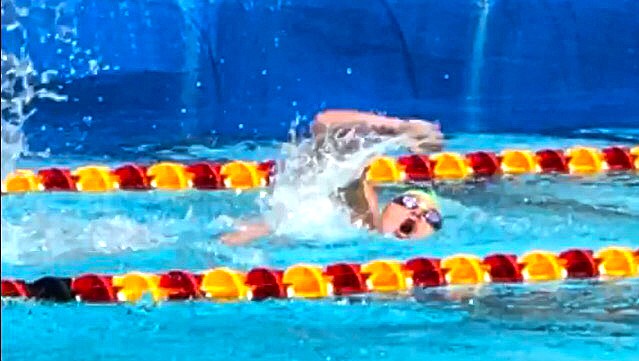 Kaylee Cole swimming in the 100-meter freestyle. (Photo courtesy of Plains Swim Team)