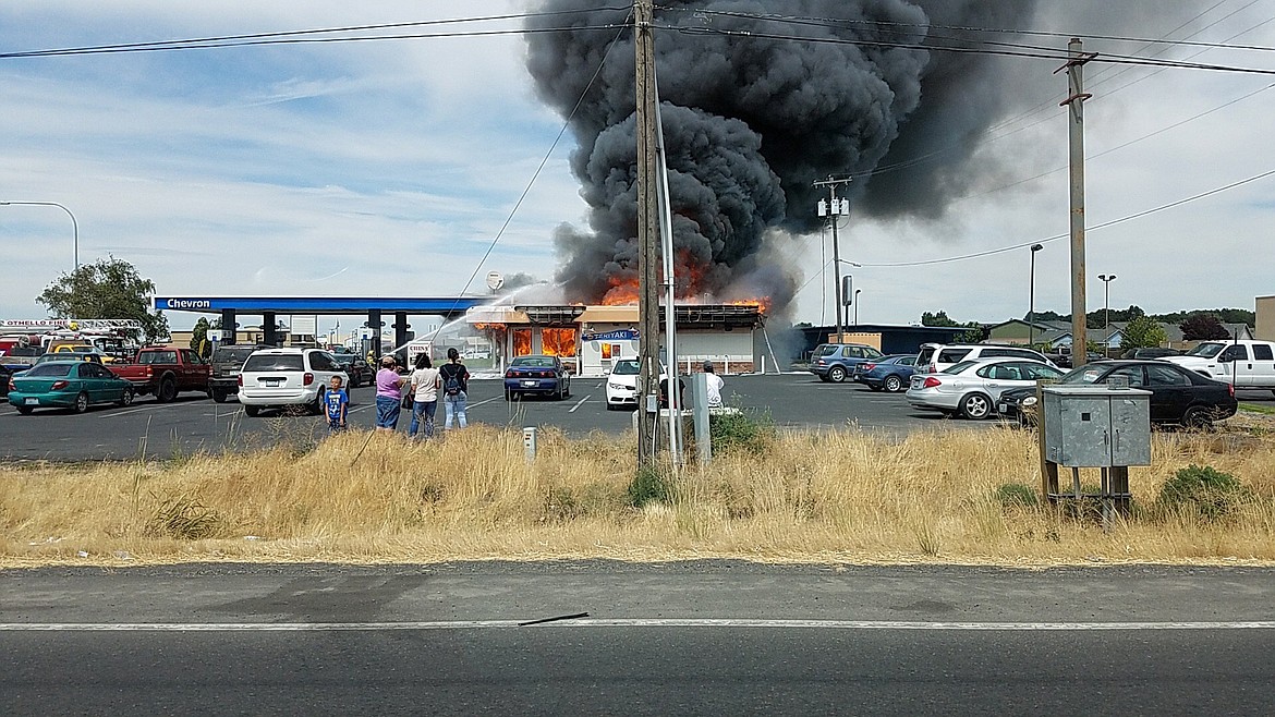 Bob Barrett/Courtesy photo - A Friday afternoon fire gutted the Pik-A-Pop convenience store on First Avenue.