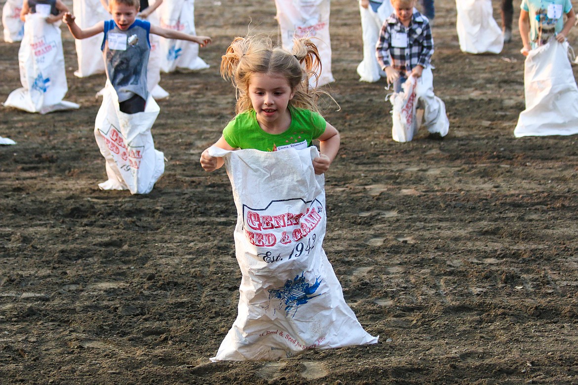 Photo by Mandi Bateman
The winner of the 3-5 year old's Gunny Sack Race, hops down the home stretch.