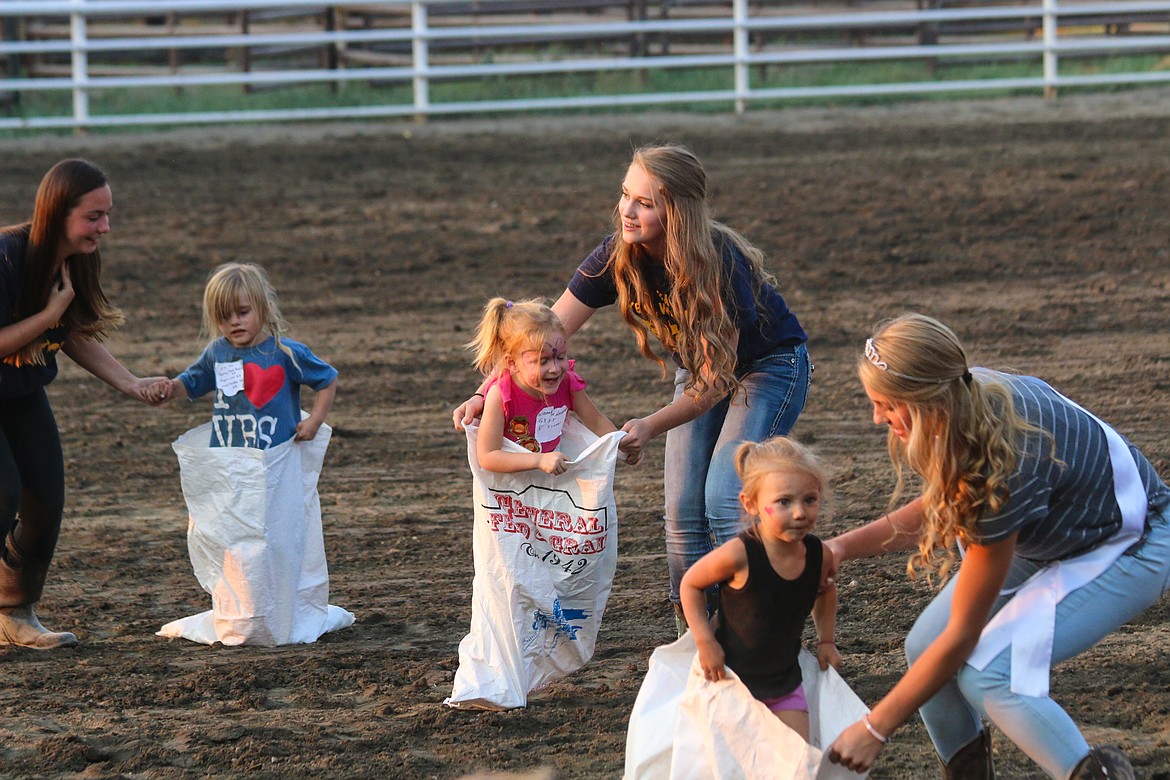 Photo by Mandi Bateman
Patient helpers kept the Gunny Sack cometitors bouncing along.