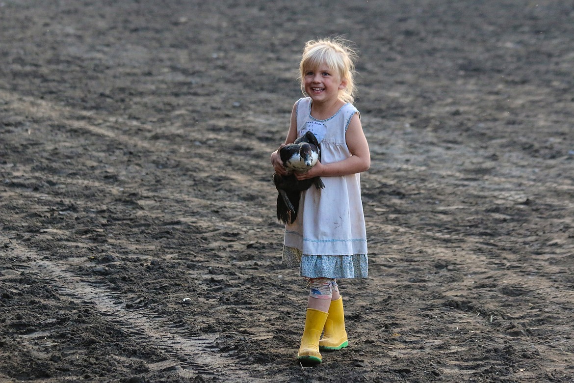 Photo by Mandi Bateman
The winners got to keep their duck, which made this young lady very happy.