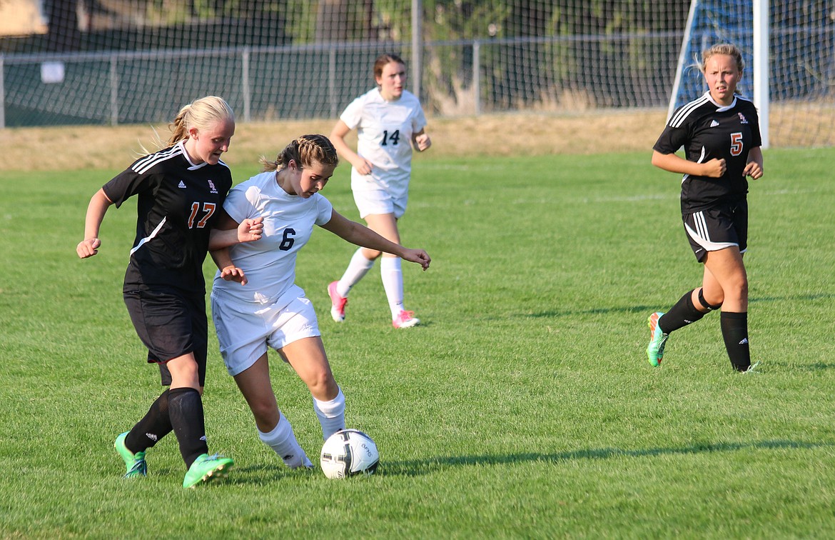 Bonner Ferry&#146;s Prairie Plaster maneuvers around a Spartan defender in Saturday&#146;s match.