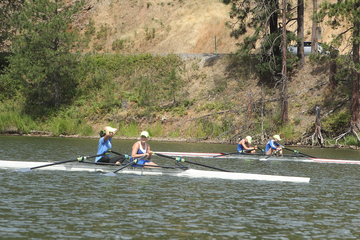 DEVIN HEILMAN/Press
Lark Hadsell, 16, left, puts her hands on her head after crossing the finish line with Ali Forster, 16, Saturday during the Fernan Frenzy regatta on Fernan Lake. The Hayden teens and their Coeur d&#146;Alene Junior Rowing teammates raced against teams from Washington and Canada. Also pictured (in the other boat): Catherine Mack, 16, of Dalton Gardens, left, and Grace Hamilton, 16, of Hayden.