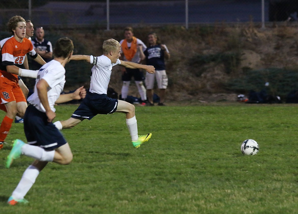 Photo by Mandi Bateman
Tyler Beazer makes a breakaway towards the Priest River goalkeeper.