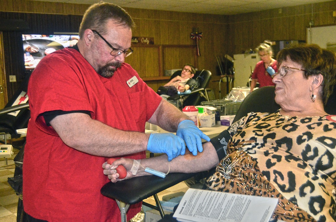 Pamela Lynch getting set for her blood donation. (Erin Jussseaume/Clark Fork Valley Press)