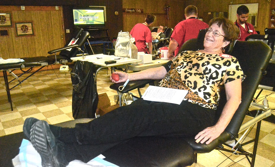 Pamela Lynch sits at the ready to give blood. (Erin Jusseaume/Clark Fork Valley Press)