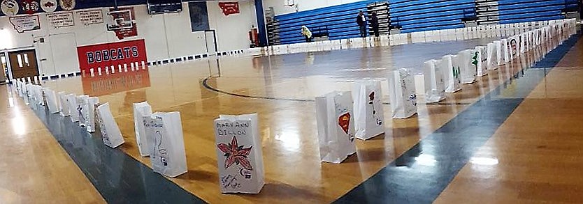 Last year’s luminaria ceremony for Relay for Life took place in the Superior High School gym due to rain, this year they were place in the hallways of the school on Aug. 17. (Photo courtesy Mineral County Relay for Life)