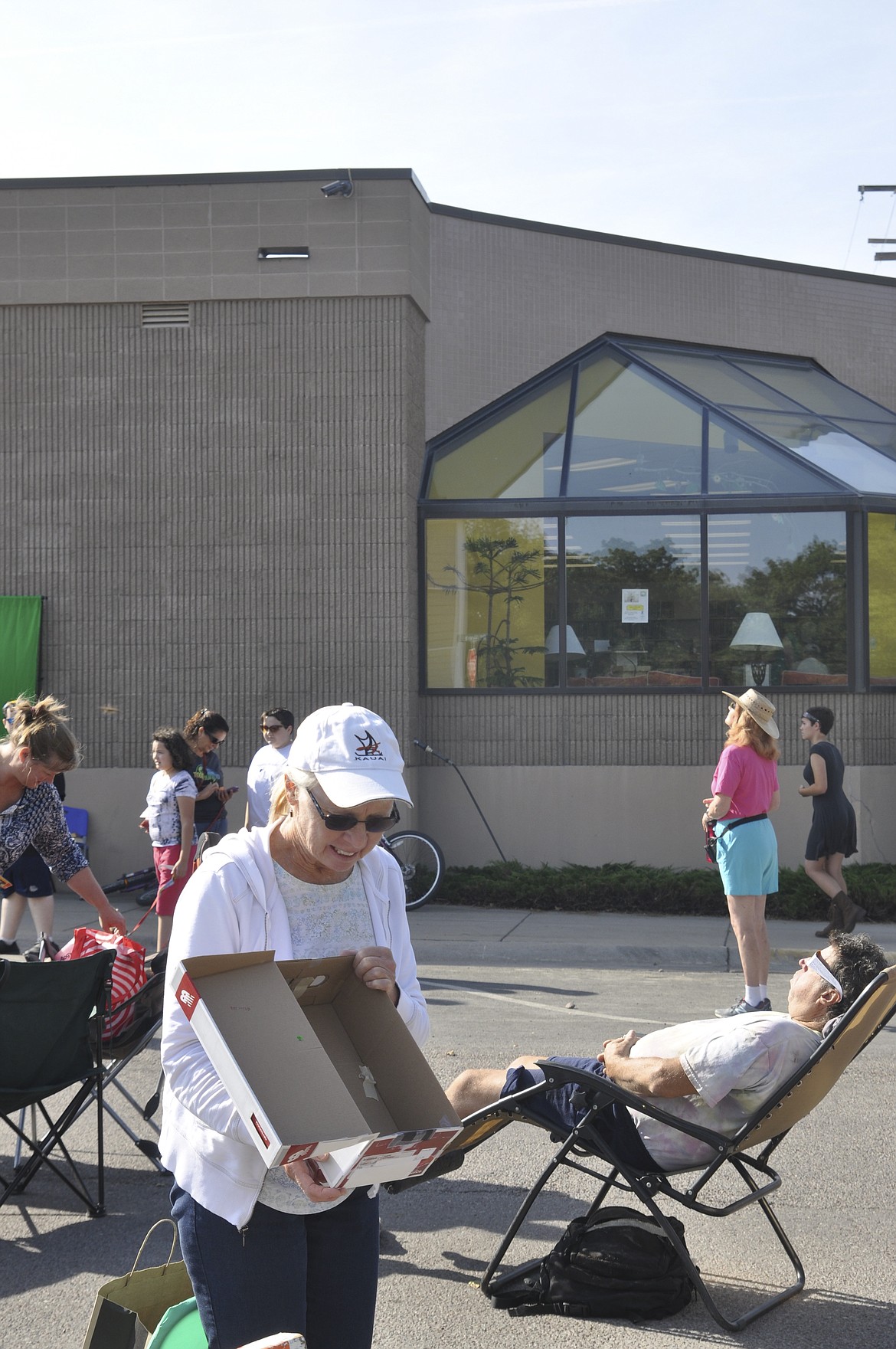 Laura Polen, of Orange County, California, was passing through the area visiting family in Missoula Monday in search of a good spot to watch the eclipse. Using Youtube.com, Polen fashioned her own pin hole contraption to safely follow the eclipse.