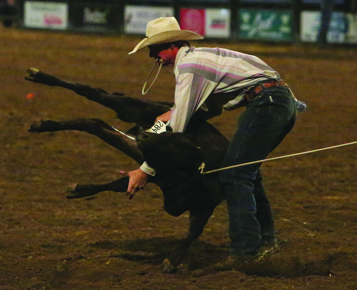 Connor Vanderweyst/Columbia Basin Herald
Soap Lake's Caleb McMillan competes in the tie-down roping competition at the Moses Lake Roundup.