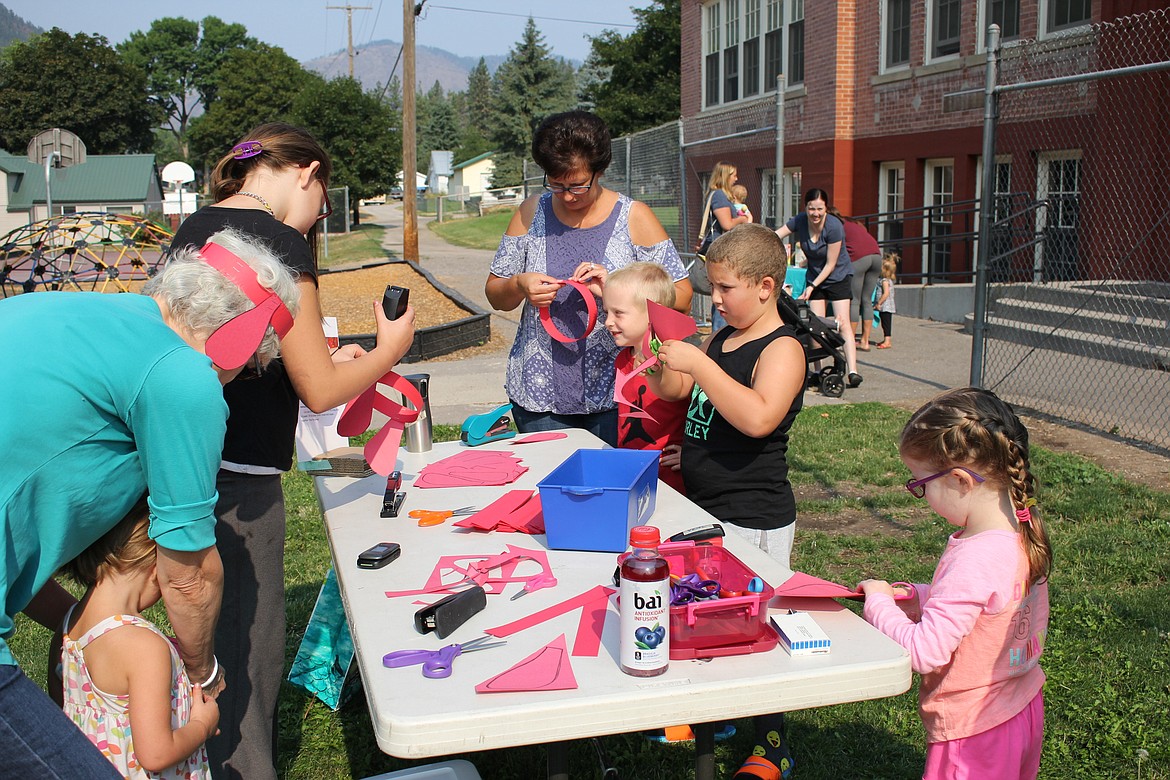 Kids got to make their own red ears during Clifford the Big Red Dog&#146;s visit to Alberton earlier this month. (Kathleen Woodford/Mineral Independent)