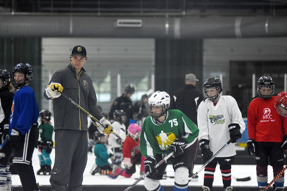 Las Vegas Golden Knight Jake Bischoff leads some local players through a drill during a clinic at Stumptown Ice Den Wednesday evening.