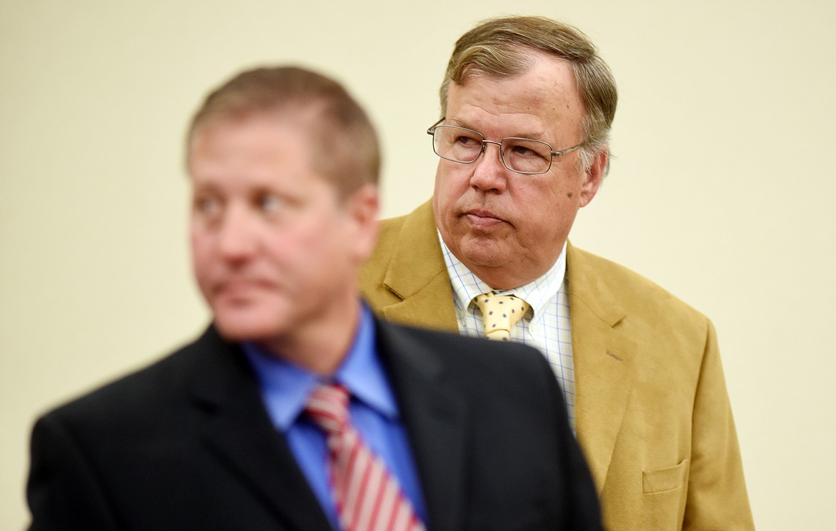 Flathead County Commissioner Phil Mitchell, right, appeared before Judge Heidi Ulbricht to enter a not guilty plea to the charge of felony criminal mischief on Thursday, August 31, in Kalispell. Mitchell is accused of killing trees at a county park which would cost over $30,000 to replace. He must report to the Flathead County Sheriff&#146;s office no later than September 1 to be formally booked and released.
(Brenda Ahearn/Daily Inter Lake)