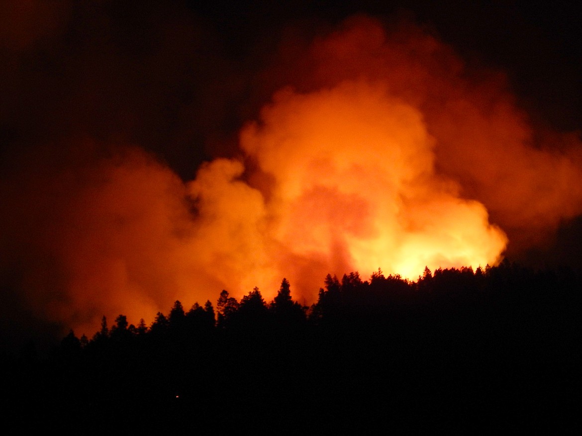 The Forest Fire near Blue Bay grew to 200 acres Wednesday evening. (A type 1 helicopter battles the fire near Blue Bay Wednesday. (Photo by Chris Kelly))