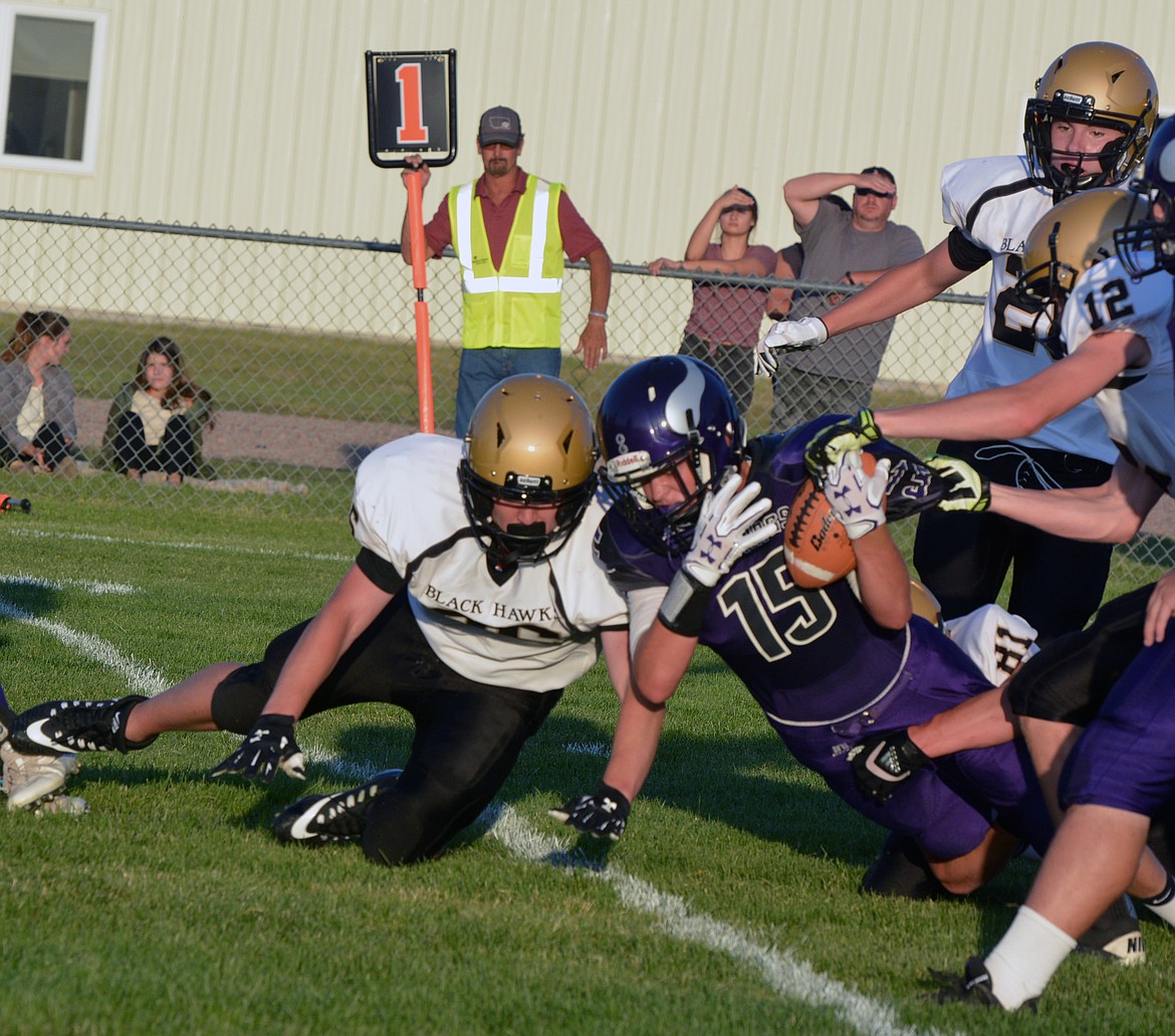 CHARLO WR Tyson Petticrew converts a successful 2-point conversion in the season-opening game against Seeley. (photo by Jason Blasco/Lake County Leader)