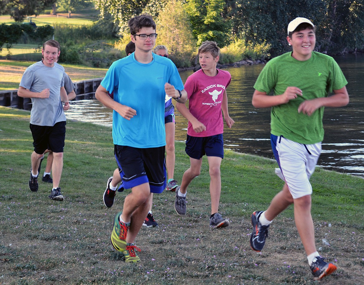 THE POLSON Pirate boys (from left): are Quin Stewart (11), Aubrey Frissell (11), Kedrick Baker (10) and Jarius Smith (11) run in Boettcher Park to train for the season. (Jason Blasco/Lake County Leader)