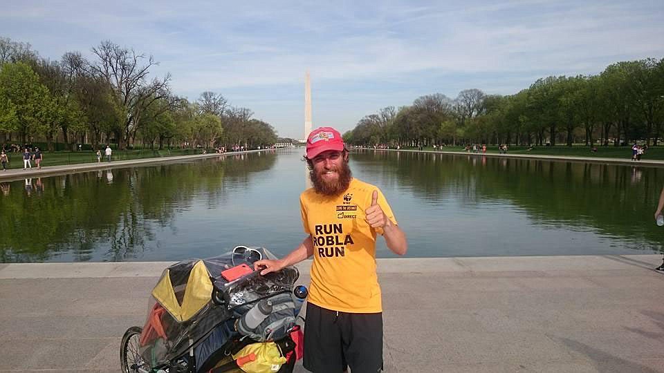 Rob Pope &#8211; pictured in Washington D.C. with the stroller he pushed before his girlfriend joined him by car &#8211; is recreating Forrest Gump's iconic journey across the United States to raise money for charity. (Boston Globe photo)