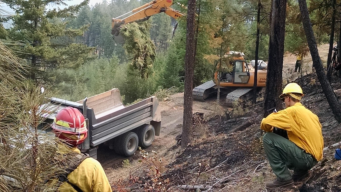 Fire crews clear trees on the Sunrise Fire which has grown to over 25,000 acres east of Superior. Forty Six Creek and Trout Creek areas have seen more fire activity this past week. (Photo courtesy of InciWeb).