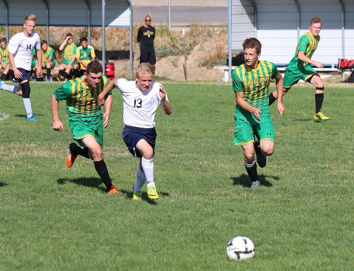 Photo by Mandi Bateman
Tyler Beazer challenging the other team for possession of the ball.