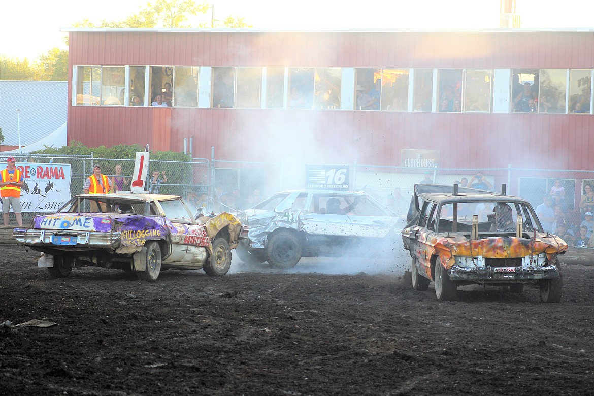 (From left) #1 Steve Henry of Kingston, #16 Walker Texas, and #42 Levi Falck kick the dust up in the second heat of the derby.