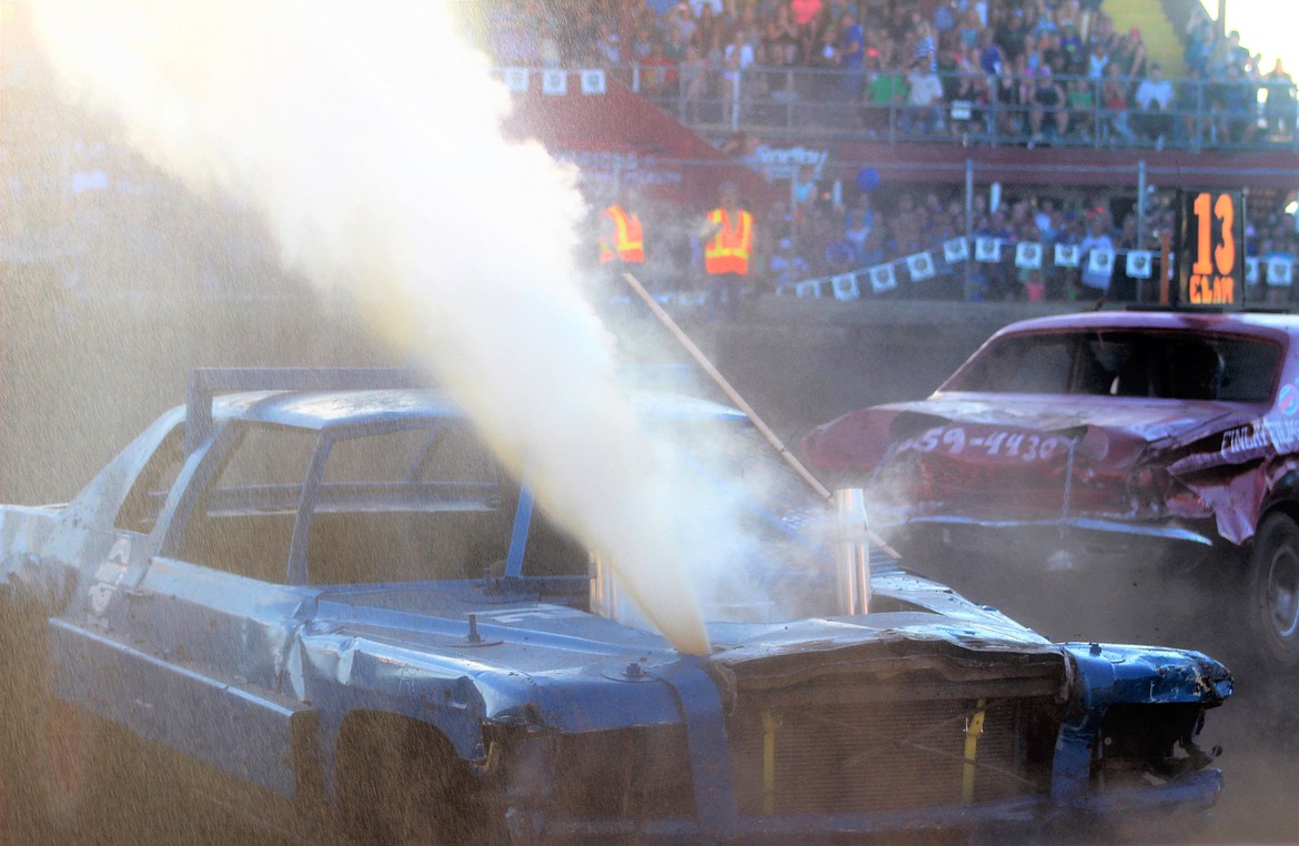 That'll buff out. 
#72 Kyle Watts' car sprays coolant after a collision with #13 Nick Elam of Kingston.