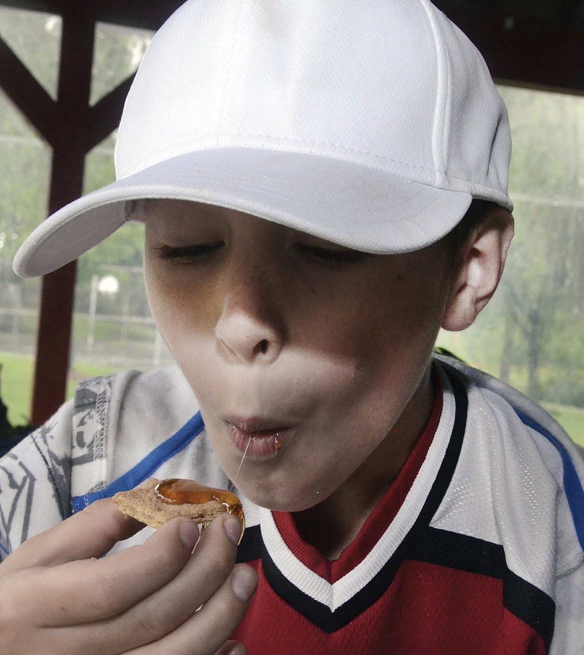 Ellen F. O&#146;Connell/Hazleton Standard-Speaker via AP
Noah Slusser takes a taste of honey during a bee presentation held Aug. 7 in Conyngham, Pa.