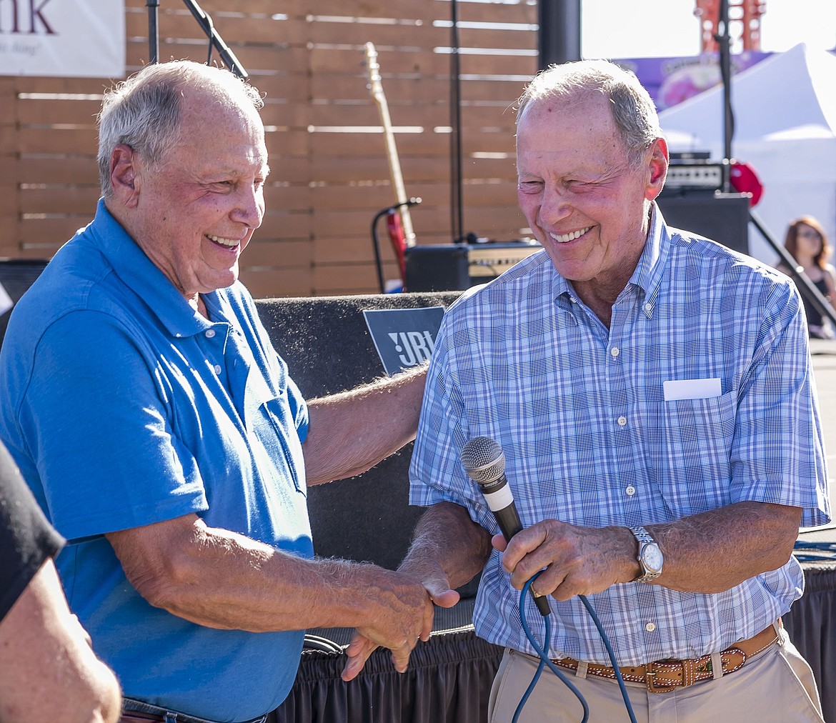 Photo courtesy of Chris Holloway
Brothers Don, left, and Doyle Jacklin share a smile and a handshake during the Friends of the Fair awards event Aug. 26 at the Kootenai County Fairgrounds. The Jacklins, specifically Don, Doyle and their late brother, Duane, were honored with the prestigious Clyde Boatright Award for their many contributions to the fair.