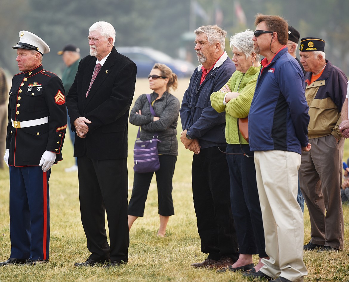 From left, Corporal Carl Hughes and Sgt. Major Al Reynolds listen to the speeches at the opening ceremony for The Wall that Heals on Thursday morning at 10 a.m. in Kalispell. The two Marines were later responsible for the placing of a wreath for the&#160;The Fraternal Brotherhood Of United States Marines&#160;near the close of the ceremony.(Brenda Ahearn/Daily Inter Lake)