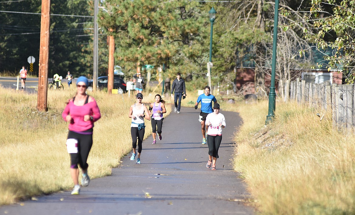 Runners make their way along path on East Lakeshore Drive during the 2016 Two Bear Marathon. (Whitefish Pilot file photo)