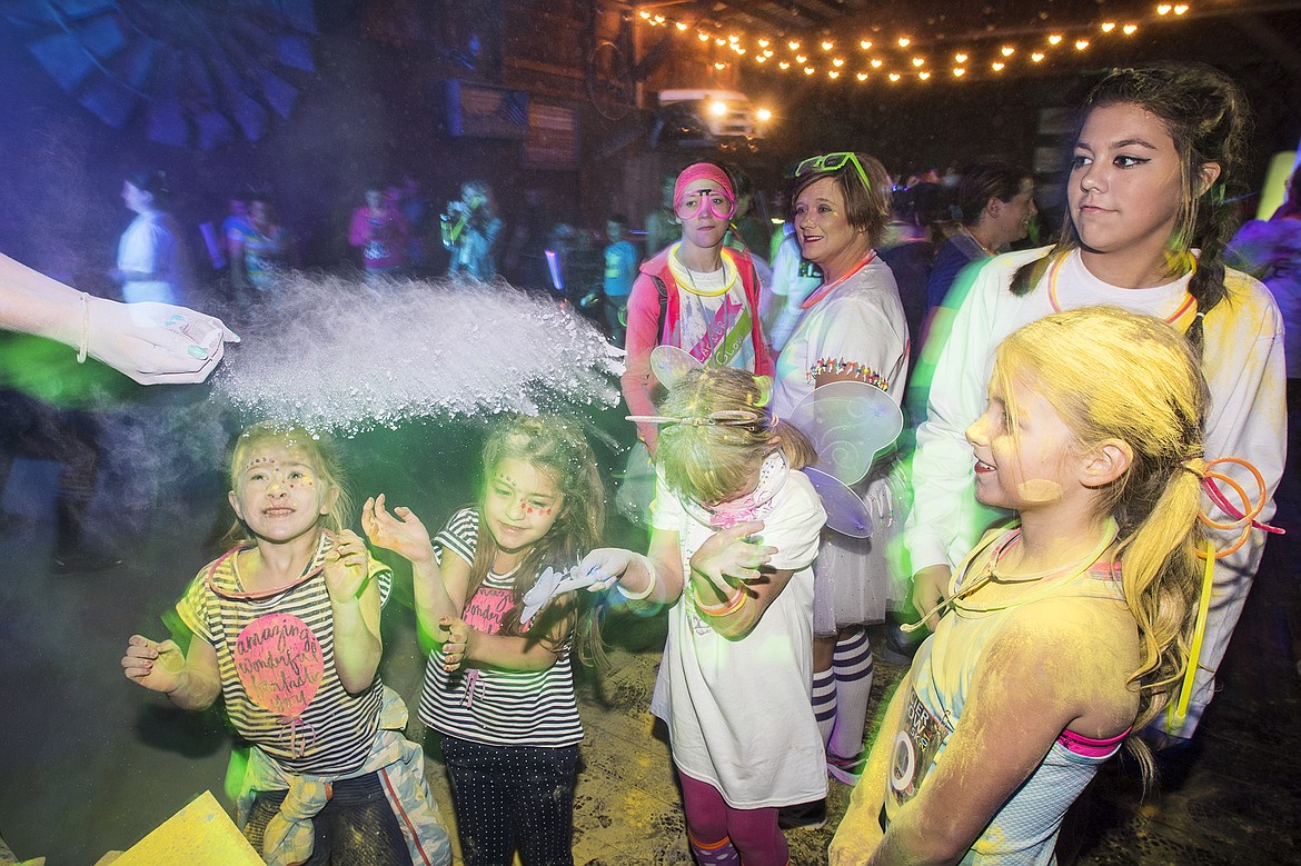 The crowd is covered in colorful chalk prior to the Glacier Glow 5K in 2016 in Columbia Falls. (Daily Inter Lake file photo)